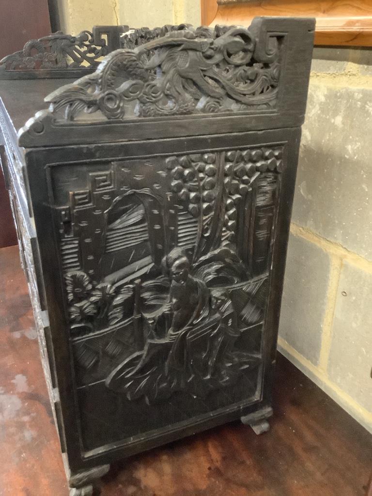 An Edwardian chinoiserie inspired ebonised oak table top cabinet, with cupboard and seven drawers, width 66cm